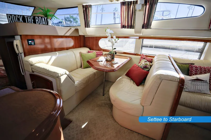 Slide: The Image of Luxurious interior of 2004 Carver 466 Motor Yacht with plush seating and elegant decor. - 14
