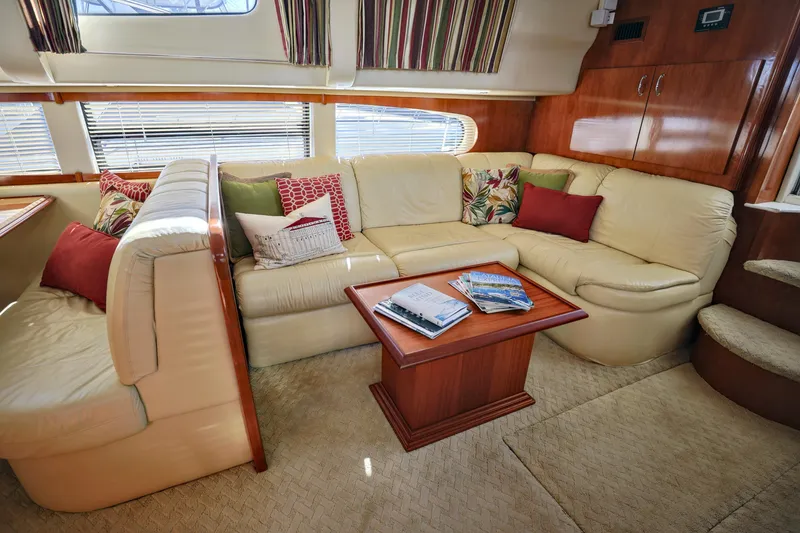 Slide: The Image of Luxurious interior of 2004 Carver 466 Motor Yacht with cozy sofa and entertainment center. - 15