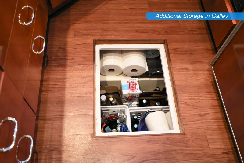 Slide: The Image of 2004 Carver 466 Motor Yacht interior with washer-dryer combo in wooden cabinet. - 19