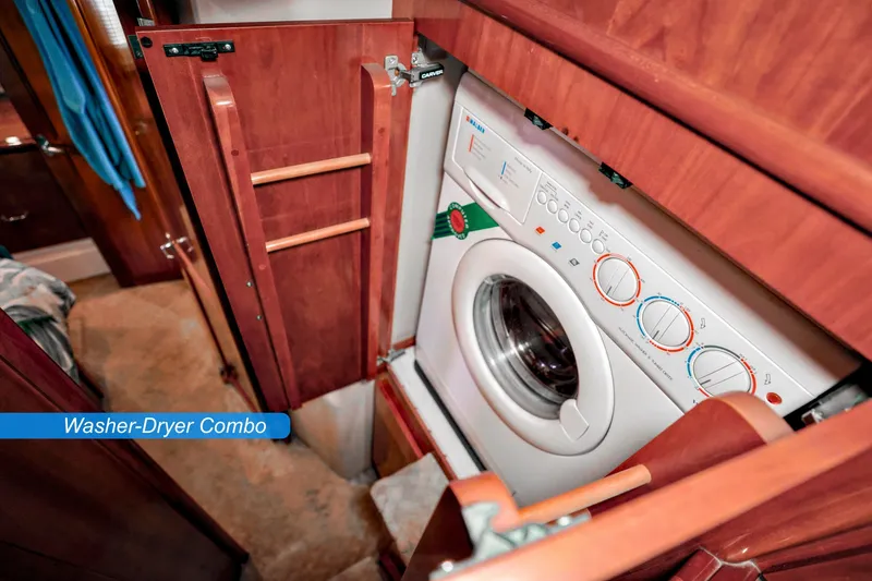 Slide: The Image of Luxurious 2004 Carver 466 Motor Yacht owner's suite with elegant bedding and wood cabinetry. - 20