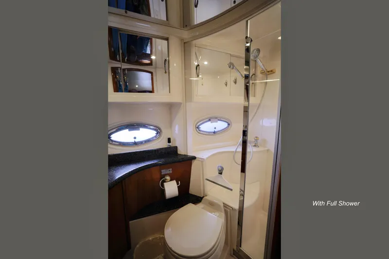 Slide: The Image of Luxurious VIP guest cabin in 2004 Carver 466 Motor Yacht, featuring elegant bedding and wood accents. - 24