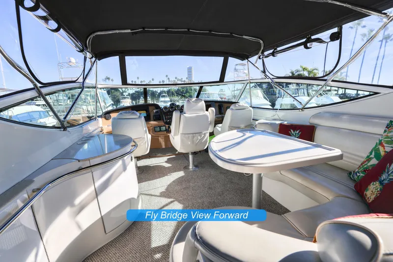 Slide: The Image of 2004 Carver 466 Motor Yacht helm with navigation screens and control panel. - 8