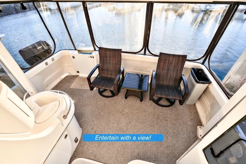 Slide: The Image of Luxurious interior of 2004 Carver 466 Motor Yacht with elegant seating and decor. - 12