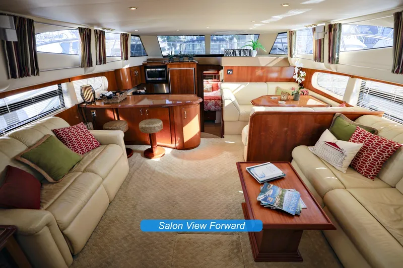 Slide: The Image of Luxurious interior of 2004 Carver 466 Motor Yacht with elegant settee and decor. - 13