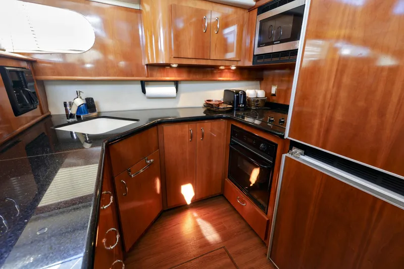 Slide: The Image of Additional storage in the galley of a 2004 Carver 466 Motor Yacht. - 18