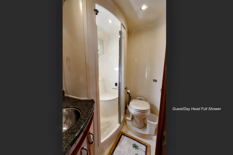 Slide: The Image of Single berth guest cabin in 2004 Carver 466 Motor Yacht, featuring cozy bedding and pillows. - 27