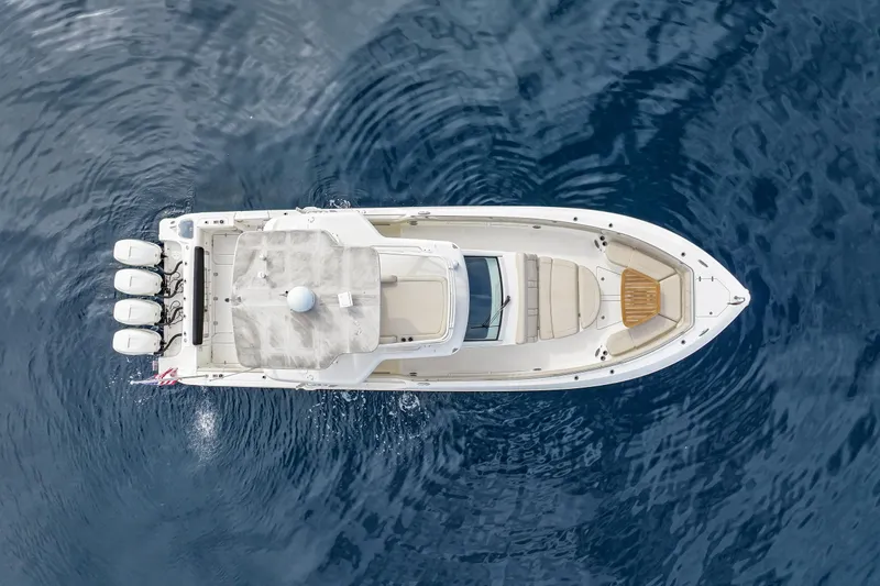 Slide: The Image of Aerial view of 2018 Boston Whaler 420 Outrage boat on calm blue water. - 11