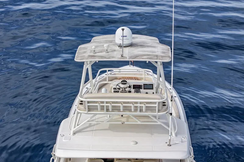 Slide: The Image of 2018 Boston Whaler 420 Outrage boat on open water, aerial view of helm and radar. - 21