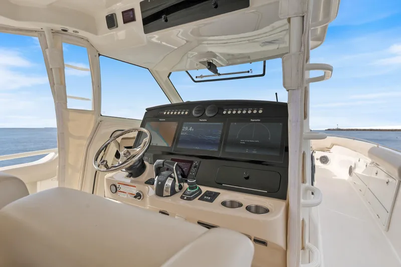 Slide: The Image of 2018 Boston Whaler 420 Outrage helm with advanced navigation system and ocean view. - 22