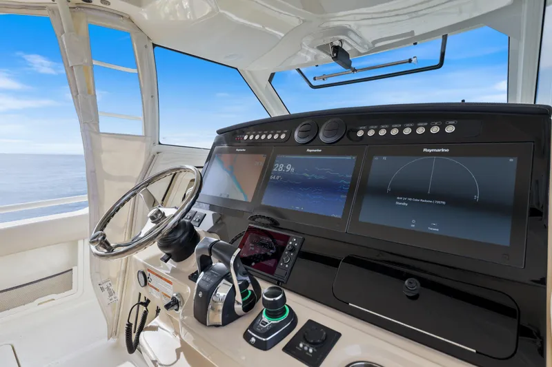 Slide: The Image of 2018 Boston Whaler 420 Outrage helm with advanced navigation displays and controls. - 24