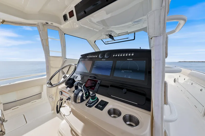 Slide: The Image of 2018 Boston Whaler 420 Outrage helm with advanced navigation displays and controls. - 25