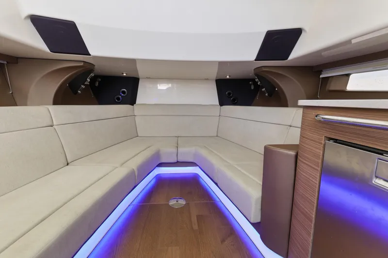 Slide: The Image of Luxurious interior of 2018 Boston Whaler 420 Outrage with ambient lighting and modern seating. - 34
