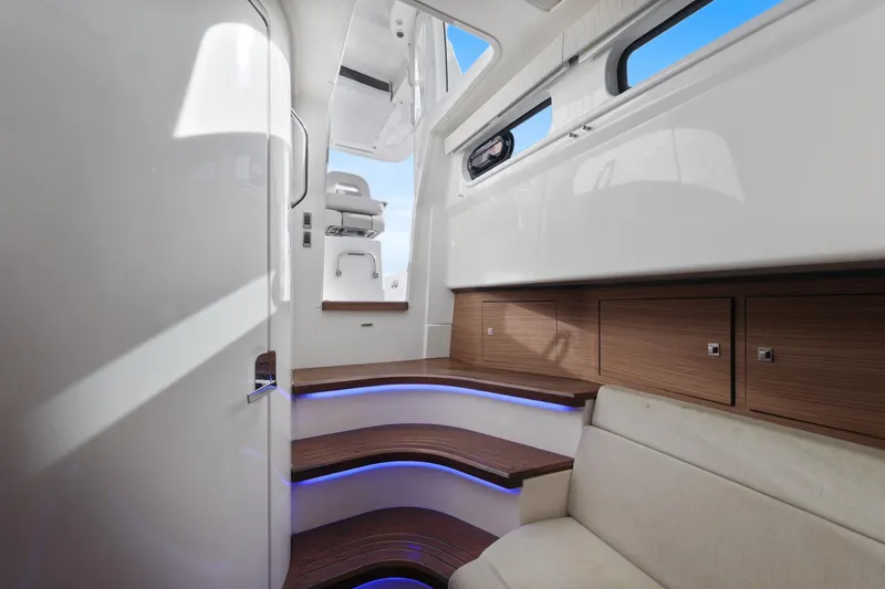 Slide: The Image of Interior of 2018 Boston Whaler 420 Outrage, featuring sleek design and modern wood accents. - 44