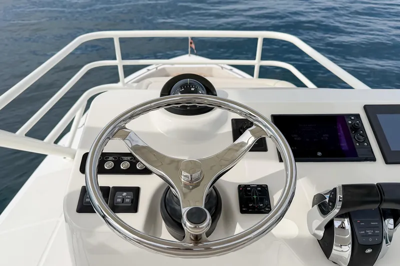 Slide: The Image of Steering console of 2018 Boston Whaler 420 Outrage on calm water. - 48