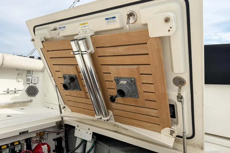 Slide: The Image of 2018 Boston Whaler 420 Outrage boat interior with wooden panel and equipment. - 69