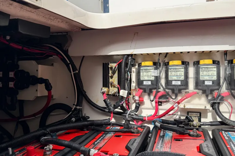Slide: The Image of Electrical system of a 2018 Boston Whaler 420 Outrage boat, featuring batteries and wiring. - 74