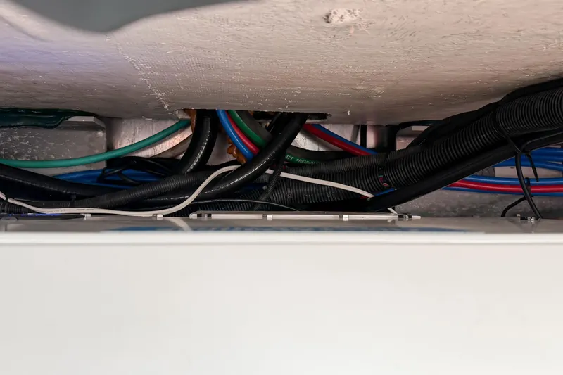 Slide: The Image of Wiring and cables inside a 2018 Boston Whaler 420 Outrage boat. - 76
