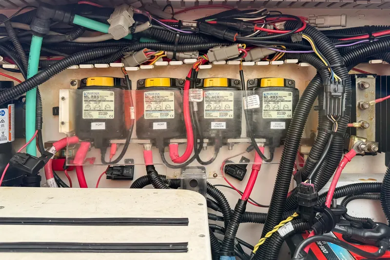 Slide: The Image of Electrical wiring and components inside a 2018 Boston Whaler 420 Outrage boat. - 77