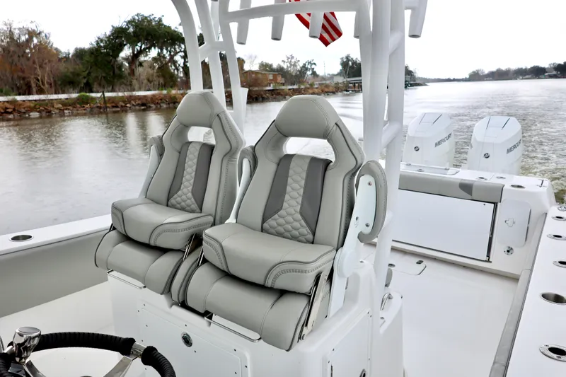 Slide: The Image of 2023 Cape Horn 34 XS boat with luxurious seating and dual outboard engines. - 13