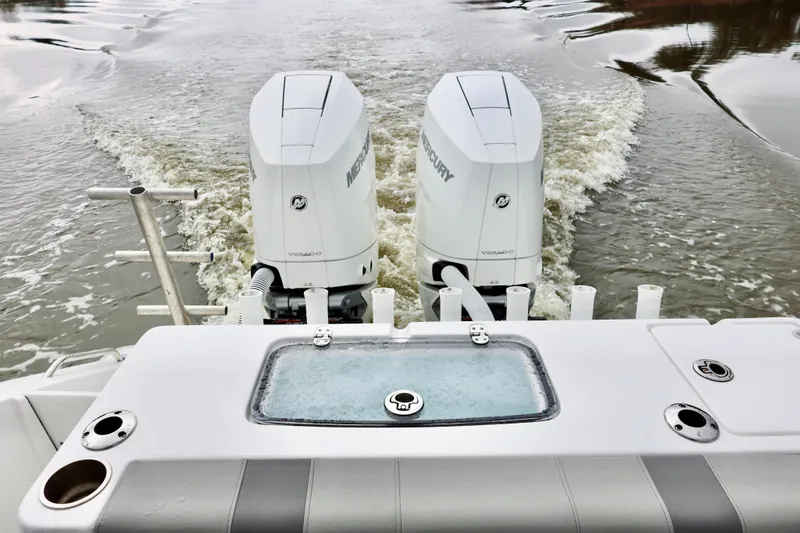 Slide: The Image of 2023 Cape Horn 34 XS boat with dual Mercury outboard engines on water. - 15