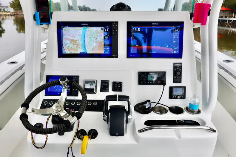 Slide: The Image of 2023 Cape Horn 34 XS boat dashboard with advanced navigation and control systems. - 12