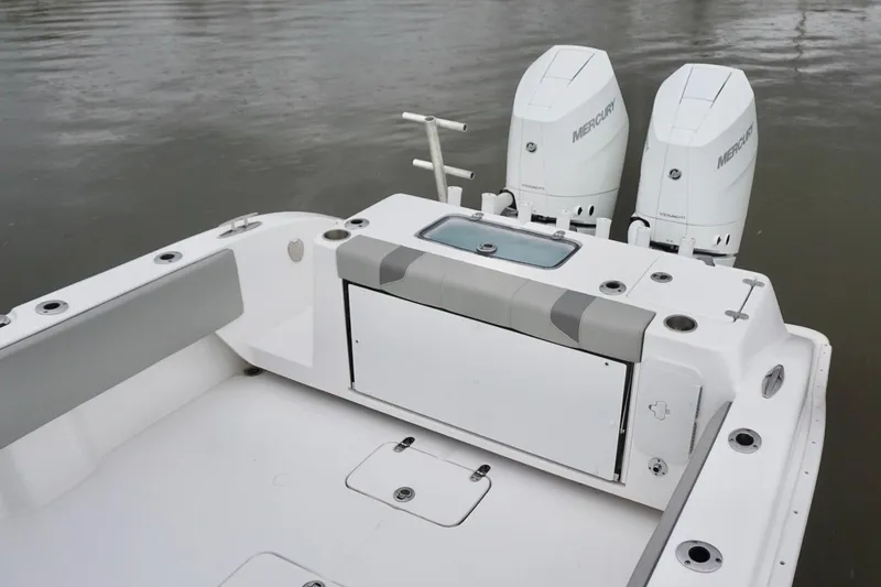 Slide: The Image of 2023 Cape Horn 34 XS boat with dual Mercury engines on calm water. - 16