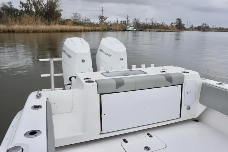 Slide: The Image of 2023 Cape Horn 34 XS boat with dual Mercury engines on a calm river. - 17