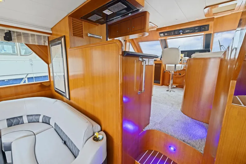 Slide: The Image of Luxurious interior of a 2002 Symbol 58 yacht with plush seating and modern helm. - 12