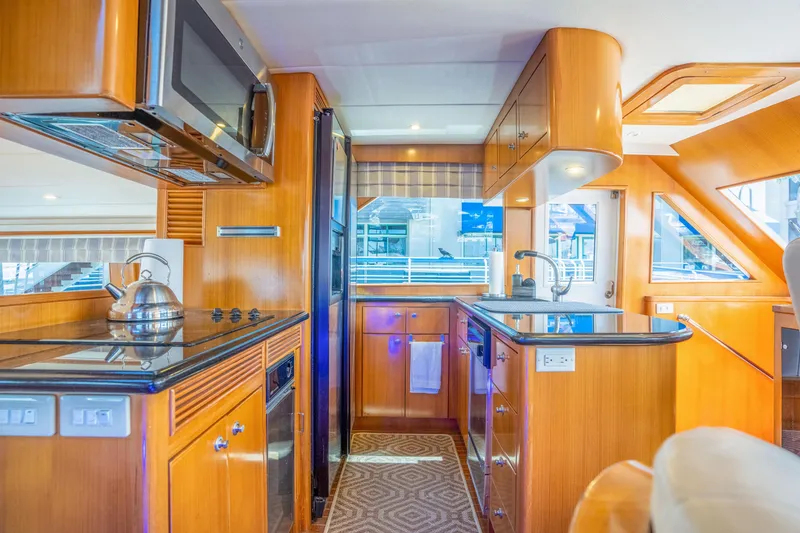 Slide: The Image of Luxurious yacht kitchen with wood paneling, Symbol 58, year 2002. - 13