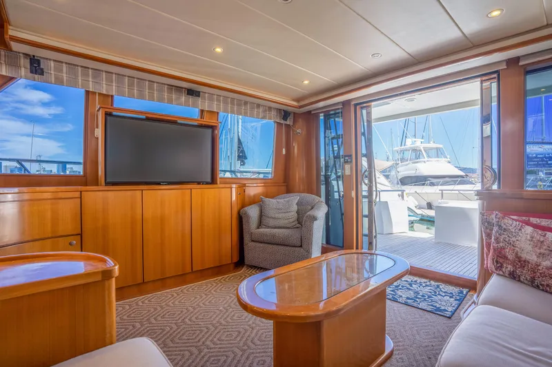 Slide: The Image of Luxurious interior of a 2002 Symbol 58 yacht with TV and harbor view. - 14