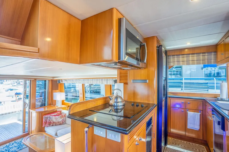 Slide: The Image of Luxurious yacht kitchen with wooden cabinetry, Symbol 58, year 2002. - 16