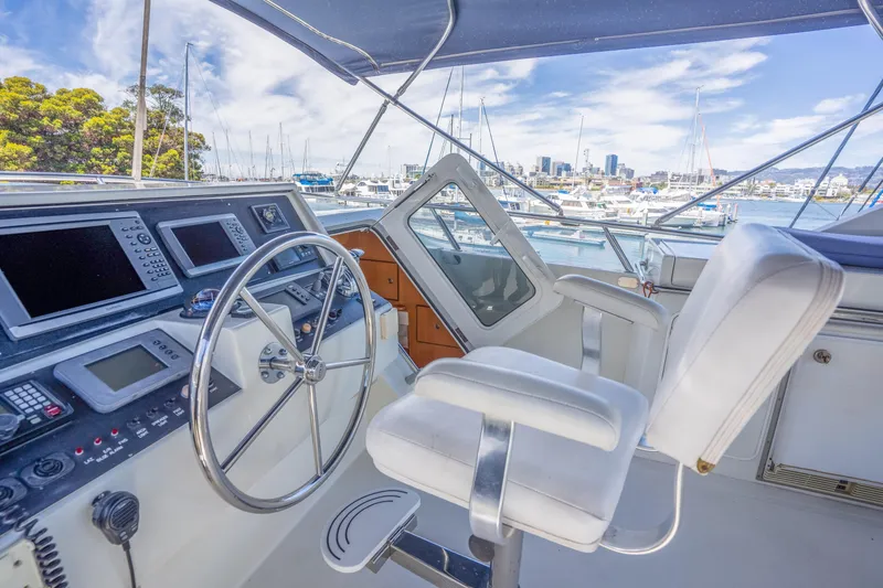 Slide: The Image of Helm of a 2002 Symbol 58 yacht docked in marina. - 31