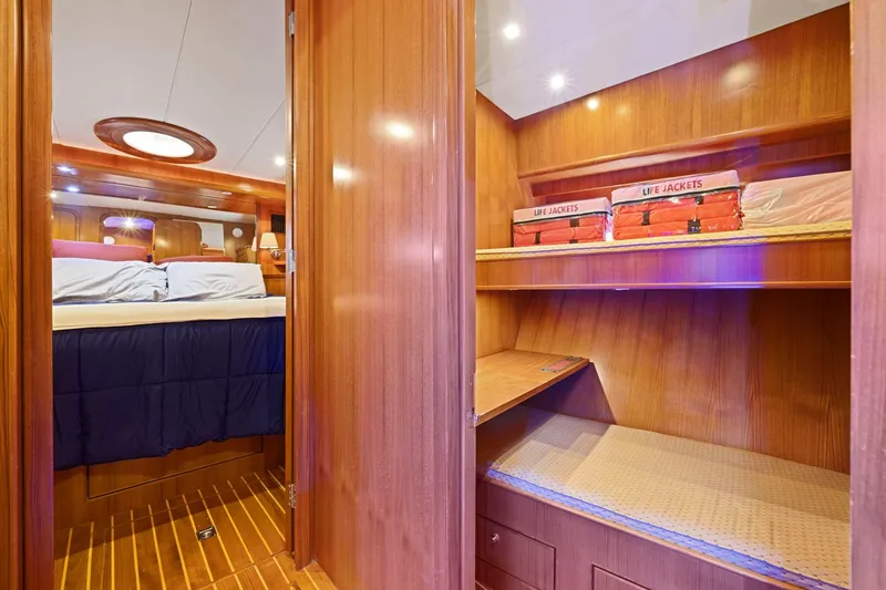 Slide: The Image of Luxurious yacht interior with cozy bedroom and life jackets, Symbol 58, 2002 model. - 49