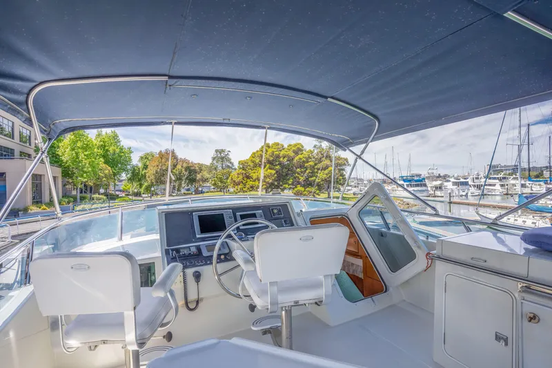 Slide: The Image of Symbol 58 yacht cockpit, 2002 model, overlooking marina. - 5