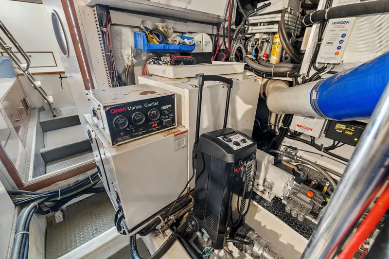 Slide: The Image of Engine room of a 2002 Symbol 58 yacht with Onan Marine GenSet. - 56