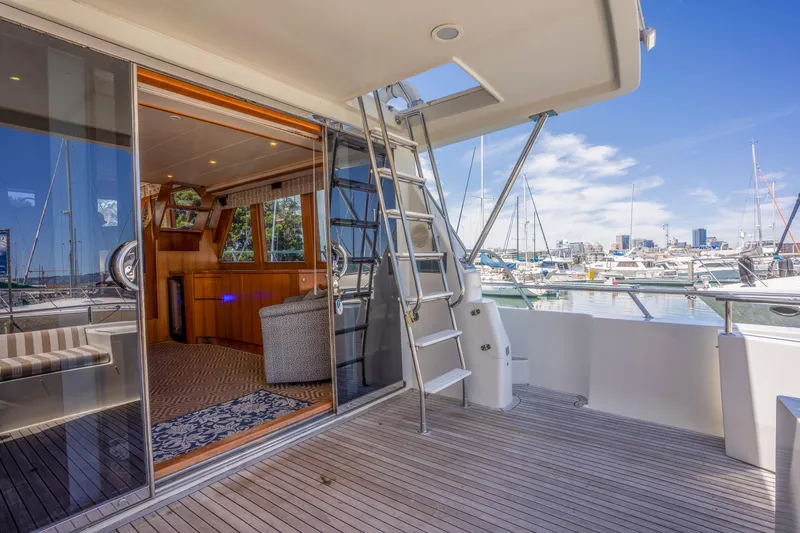 Slide: The Image of 2002 Symbol 58 yacht with open deck and harbor view. - 7