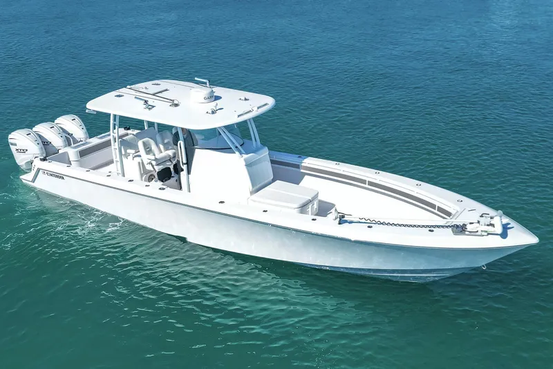 The Image of 2024 Contender 39 ST boat on clear blue water, featuring triple outboard engines. - 0