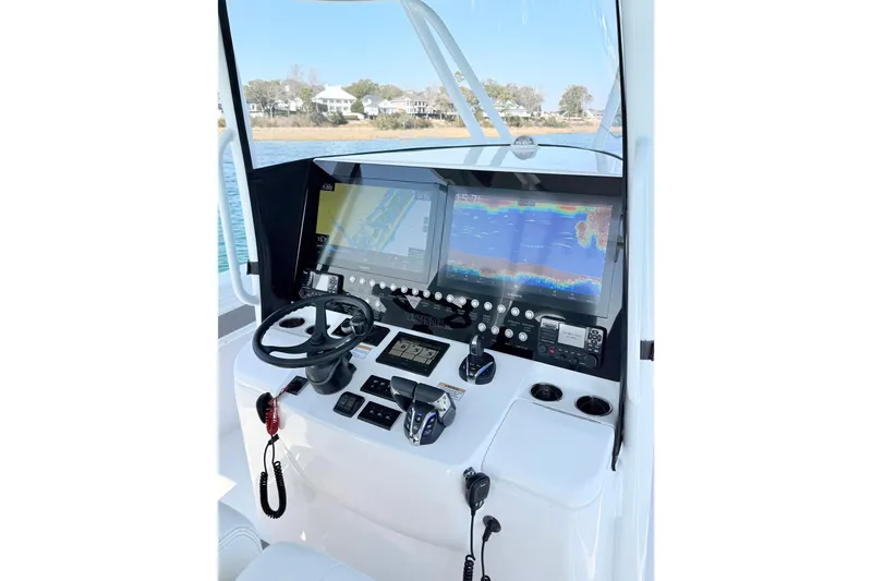 Slide: The Image of 2024 Contender 39 ST boat dashboard with advanced navigation and control systems. - 14
