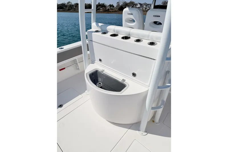 Slide: The Image of 2024 Contender 39 ST boat interior with rod holders and storage compartment. - 20