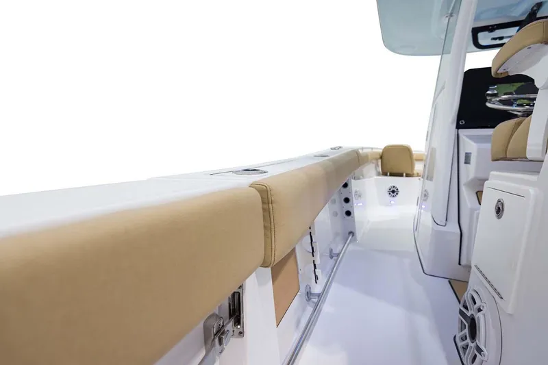 Slide: The Image of Manufacturer Provided Image: 2024 Sportsman Open 302 Center Console boat interior with tan seating and white deck. - 20