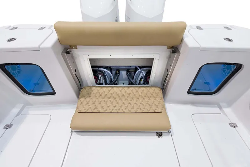 Slide: The Image of Manufacturer Provided Image: 2024 Sportsman Open 302 Center Console boat with tan seating and storage compartment. - 25