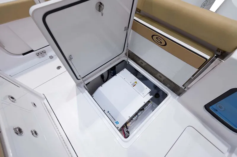Slide: The Image of Manufacturer Provided Image: 2024 Sportsman Open 302 Center Console storage compartment with electrical components. - 29