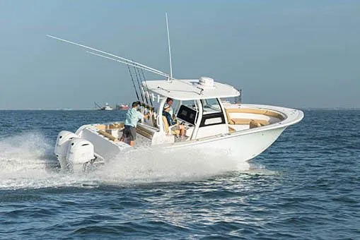 Slide: The Image of Manufacturer Provided Image: 2024 Sportsman Open 302 Center Console boat cruising on the water. - 36