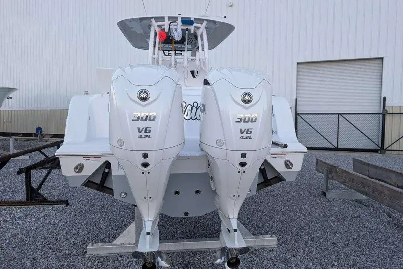 Slide: The Image of 2024 Sportsman Open 302 Center Console with twin Yamaha 300 V6 engines. - 38