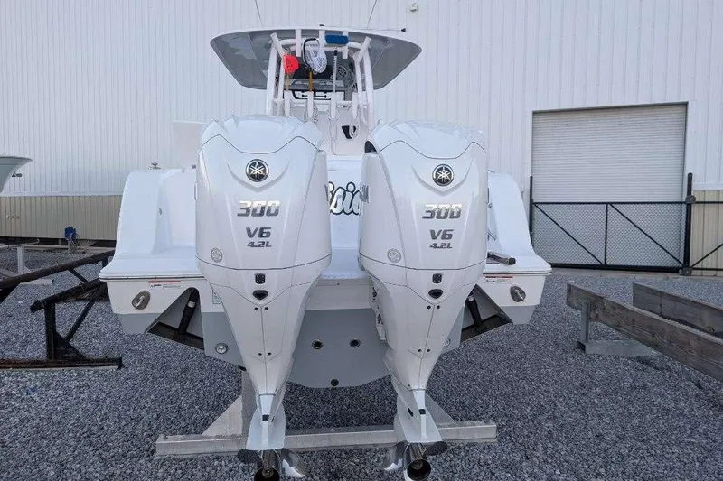 Slide: The Image of 2024 Sportsman Open 302 Center Console with twin Yamaha 300 V6 engines. - 42