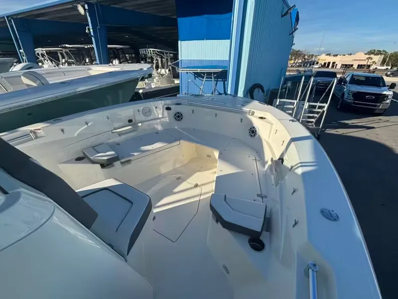 Slide: The Image of 2026 Cobia 245 Center Console boat docked at marina. - 10
