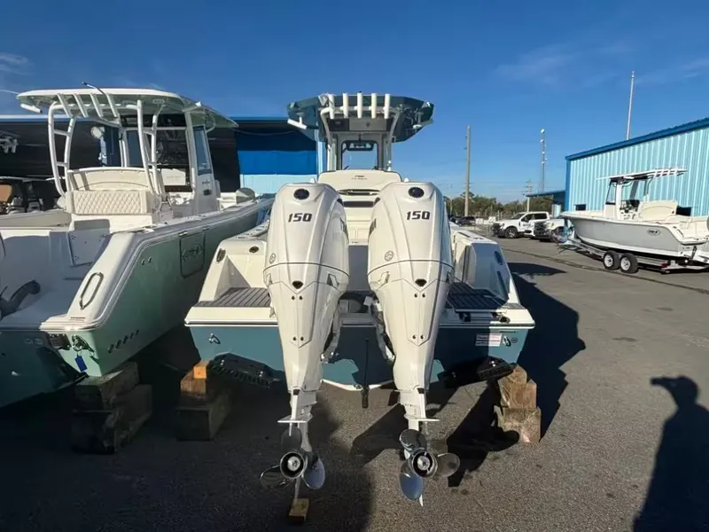Slide: The Image of 2026 Cobia 245 Center Console with twin outboard engines. - 4