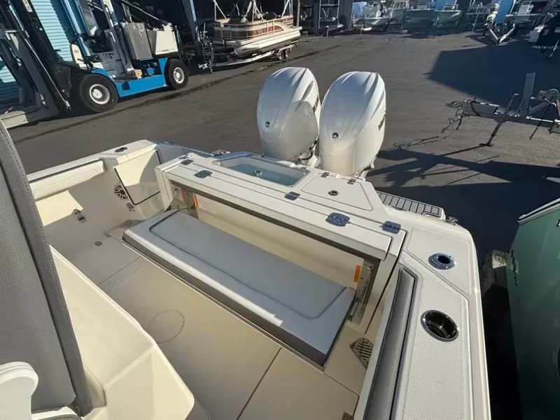 Slide: The Image of 2026 Cobia 245 Center Console with dual engines at the dock. - 5