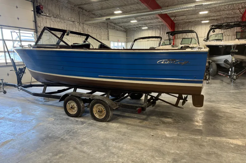 Slide: The Image of 1959 Chris-Craft 22 Sea Skiff boat on trailer in indoor storage. - 3