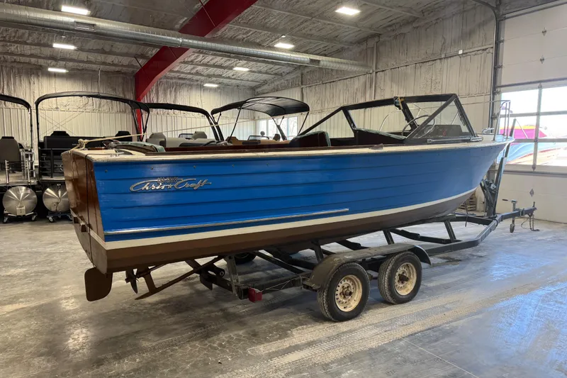 Slide: The Image of 1959 Chris-Craft 22 Sea Skiff boat on trailer in indoor storage facility. - 4
